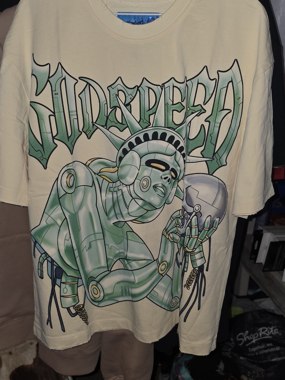 Cream Short-Sleeve Graphic Tee with Green Robot Statue Design
